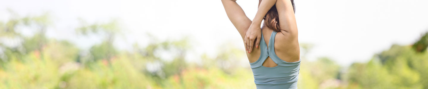 Woman stretching shoulder Woman stretching shoulder