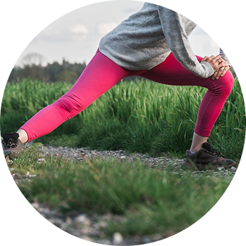 Woman stretching her hip Woman stretching her hip