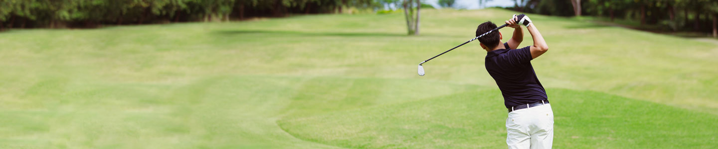 man swinging golf club man swinging golf club